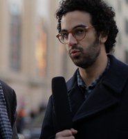 Street interviewer with a microphone