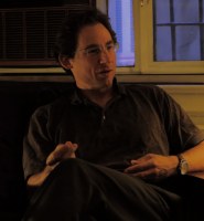 Man interviewed about Twilight, seated by a window