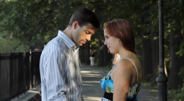A young couple face to face on a tree-lined path, scene from the Twilight documentary